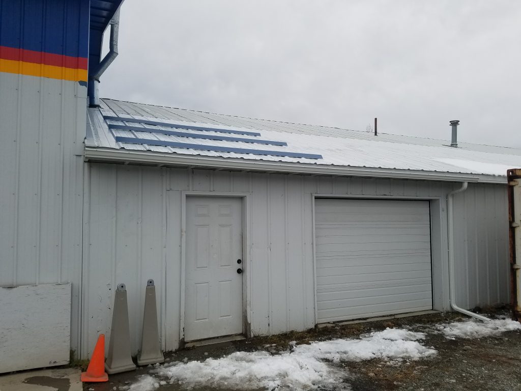 White metal roof installed on building